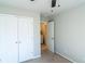 Bedroom featuring carpeted floors and closet with double doors next to the laundry room at 3293 Pennington Dr, Stonecrest, GA 30038
