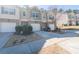 Exterior view of charming townhomes in a well-maintained neighborhood with manicured lawns at 3293 Pennington Dr, Stonecrest, GA 30038