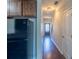 Hallway with dark hardwood floors and neutral walls, leading to other areas of the house at 3293 Pennington Dr, Stonecrest, GA 30038