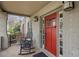 Inviting front porch with rocking chairs, a red door, and brick detailing at 101 Terrace Dr, Atlanta, GA 30305