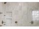 Luxurious marble tiled shower with glass door and brushed nickel hardware at 101 Terrace Dr, Atlanta, GA 30305