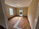 Bedroom with hardwood floors, window for natural light and a view leading to the kitchen at 1907 Langston Sw Ave, Atlanta, GA 30310