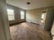 Spacious bedroom with hardwood floors, windows that provide natural lighting, and an open layout at 1907 Langston Sw Ave, Atlanta, GA 30310