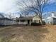 Charming home with a covered porch, surrounded by mature trees and a cozy yard at 1907 Langston Sw Ave, Atlanta, GA 30310