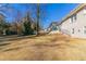 Expansive backyard featuring a gentle slope and mature trees providing ample shade and privacy at 2592 Miriam Ln, Decatur, GA 30032