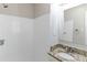 Modern bathroom with white tile, granite countertop vanity, and new fixtures at 2592 Miriam Ln, Decatur, GA 30032
