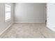 Neutral bedroom showcasing plush carpeting and a window allowing for natural light at 2592 Miriam Ln, Decatur, GA 30032