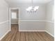 Elegant dining room with modern chandelier and hardwood flooring at 2592 Miriam Ln, Decatur, GA 30032