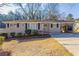 Charming brick home with a well-manicured front yard and an attached carport at 2592 Miriam Ln, Decatur, GA 30032