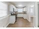 Well-lit kitchen with white cabinets, stainless steel appliances, and granite countertops at 2592 Miriam Ln, Decatur, GA 30032
