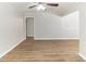 Bright living room featuring hardwood floors and a ceiling fan at 2592 Miriam Ln, Decatur, GA 30032