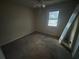 Empty bedroom with window and ceiling fan at 2955 Preston Dr, Rex, GA 30273