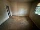 An empty bedroom featuring natural light from the window at 2955 Preston Dr, Rex, GA 30273
