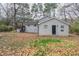 The back exterior shows both sides of the home, including the back porch and siding at 2304 Wesley Chapel Rd, Decatur, GA 30035