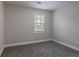Empty bedroom with gray carpet and natural light at 2304 Wesley Chapel Rd, Decatur, GA 30035