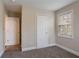 Bedroom features neutral walls and carpeted floors at 2304 Wesley Chapel Rd, Decatur, GA 30035