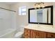 Bathroom featuring tile floors, shower-tub combo, and vanity at 3550 Beaver Cove Rd, Cumming, GA 30041