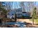 Charming two-story home with a double balcony and well-manicured landscaping at 3550 Beaver Cove Rd, Cumming, GA 30041