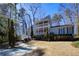 Charming two-story home with a double balcony and well-manicured landscaping at 3550 Beaver Cove Rd, Cumming, GA 30041