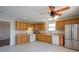 Spacious kitchen with tile flooring, oak cabinets, and stainless steel refrigerator at 3550 Beaver Cove Rd, Cumming, GA 30041