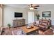 Cozy living room with hardwood floors, stylish furnishings, and plenty of natural light at 3550 Beaver Cove Rd, Cumming, GA 30041