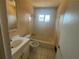 Full bathroom with a tub-shower combination, classic tile, and functional vanity; ready for renovation at 3623 Stanford Cir, Decatur, GA 30034