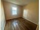 Bright bedroom featuring hardwood floors and a window with a view, perfect for relaxation at 3623 Stanford Cir, Decatur, GA 30034