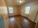Comfortable bedroom featuring hardwood floors and dual windows that provide ample natural light at 3623 Stanford Cir, Decatur, GA 30034