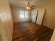 Cozy bedroom with hardwood floors, ceiling fan, and natural light from the window at 3623 Stanford Cir, Decatur, GA 30034