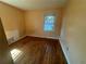 Cozy bedroom showcasing hardwood floors and a window that fills the room with soft, natural light at 3623 Stanford Cir, Decatur, GA 30034