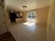 Bright dining area with tile flooring, sliding glass doors, and open access to the kitchen at 3623 Stanford Cir, Decatur, GA 30034