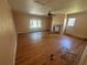 Spacious living room featuring hardwood floors, natural light from a large window, and a classic fireplace at 3623 Stanford Cir, Decatur, GA 30034