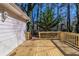 The sunny wooden back deck features sturdy wooden railings and access to the yard at 6381 Phillips Creek Dr, Lithonia, GA 30058