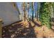 Spacious backyard with mature trees, offering shade and privacy at 6381 Phillips Creek Dr, Lithonia, GA 30058
