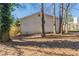 The backyard has a wood deck, and mature trees at 6381 Phillips Creek Dr, Lithonia, GA 30058