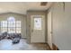 Entryway featuring a decorative front door, damaged walls, and modern wood-look flooring at 6381 Phillips Creek Dr, Lithonia, GA 30058