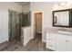 Bathroom featuring a glass-enclosed shower, neutral colors, and nice vanity at 951 Olmsted Ln, Johns Creek, GA 30097