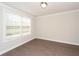 Cozy bedroom with hardwood floors, neutral walls, and natural light at 951 Olmsted Ln, Johns Creek, GA 30097