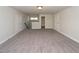 Large bonus room featuring neutral carpet, white walls, and doors at 951 Olmsted Ln, Johns Creek, GA 30097