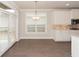 Bright eat-in kitchen area with hardwood floors and natural light from the windows at 951 Olmsted Ln, Johns Creek, GA 30097
