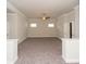 Spacious living room offering comfortable carpet, neutral walls, and plenty of room at 951 Olmsted Ln, Johns Creek, GA 30097