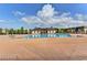 Community pool surrounded by a large sun deck and pool house at 951 Olmsted Ln, Johns Creek, GA 30097