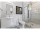 Contemporary bathroom featuring a floating vanity and a modern glass-enclosed shower with marbled tile at 1002 Citadel Ne Dr, Atlanta, GA 30324