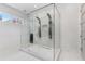 Modern bathroom with a glass-enclosed shower featuring dual shower heads and white marble-style walls at 1002 Citadel Ne Dr, Atlanta, GA 30324