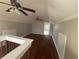 Bedroom, hardwood floors, two ceiling fans, adjoined bathroom at 939 Hope Sw Dr, Atlanta, GA 30310