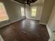 Bedroom needing repair, hardwood floors, two windows at 939 Hope Sw Dr, Atlanta, GA 30310