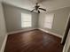 Cozy bedroom with hardwood floors, neutral paint, and natural light at 939 Hope Sw Dr, Atlanta, GA 30310