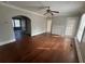 Spacious living room featuring hardwood floors, archway, and large windows at 939 Hope Sw Dr, Atlanta, GA 30310