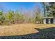Backyard features a mature tree line and structure at 940 Blair Bridge Rd, Austell, GA 30168