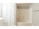 Well-lit bathroom features a shower-tub combo and closet at 940 Blair Bridge Rd, Austell, GA 30168